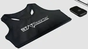 A sleek black sports bra top paired with a remote control, showcasing an innovative approach to activewear.