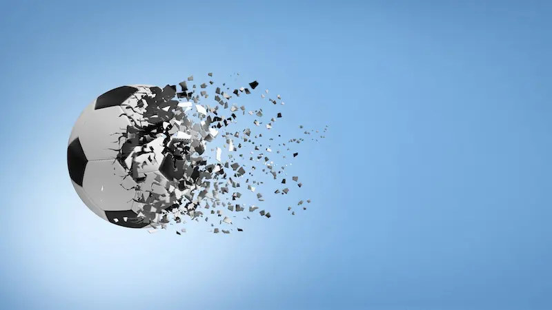 Soccer ball disintegrating in mid air