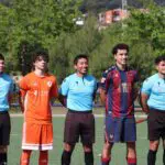 Futedu academy players and ref before a match