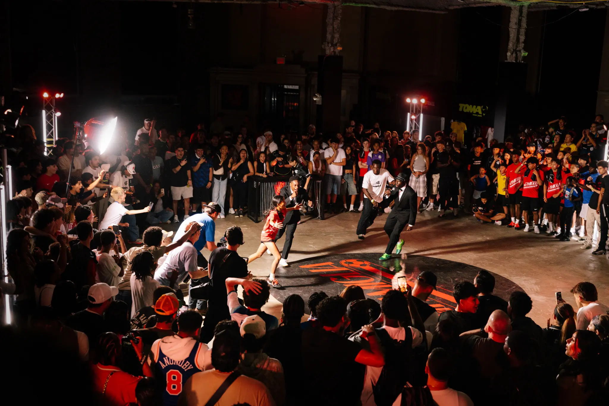 Crowded indoor street soccer event with young players and fans surrounding the pitch, showcasing Youth 4 Youth FC’s player-led culture, high-energy atmosphere, and urban youth soccer pathway.