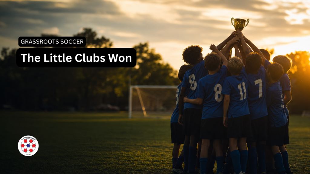 Youth soccer team lifting a championship trophy at sunset — 2026 USYS National Championships grassroots recap