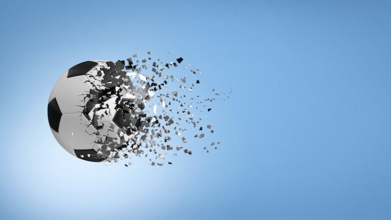 Soccer ball disintegrating in mid air