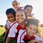 Young kids happy on the soccer pitch