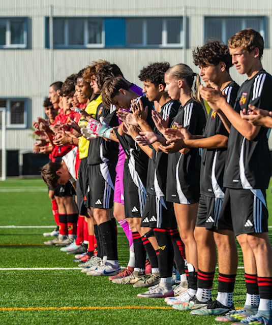 Mesa Team after a match standing on the pitch