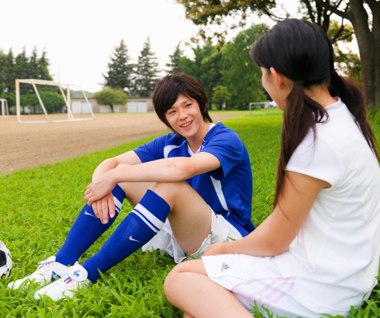 youth soccer player and parent talking
